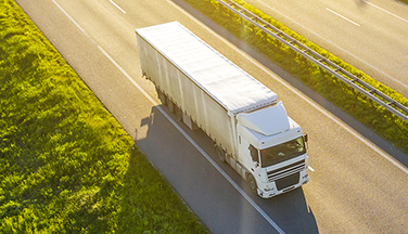 Semi truck driving on highway.