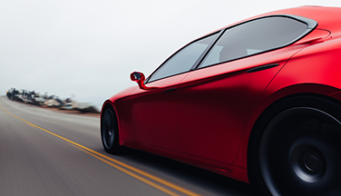 Red car driving down road to promote ILSAC GF-7 presee release