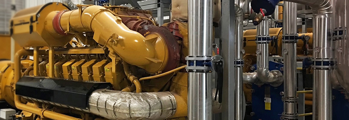 Close-up of large gas engine.