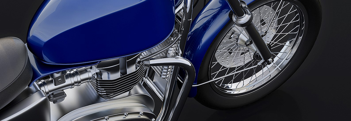 Close-up of blue motorcycle.