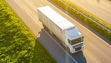 Semi truck driving on highway.