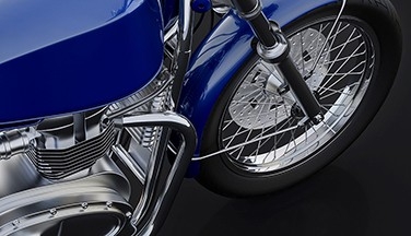 Close-up of blue motorcycle.